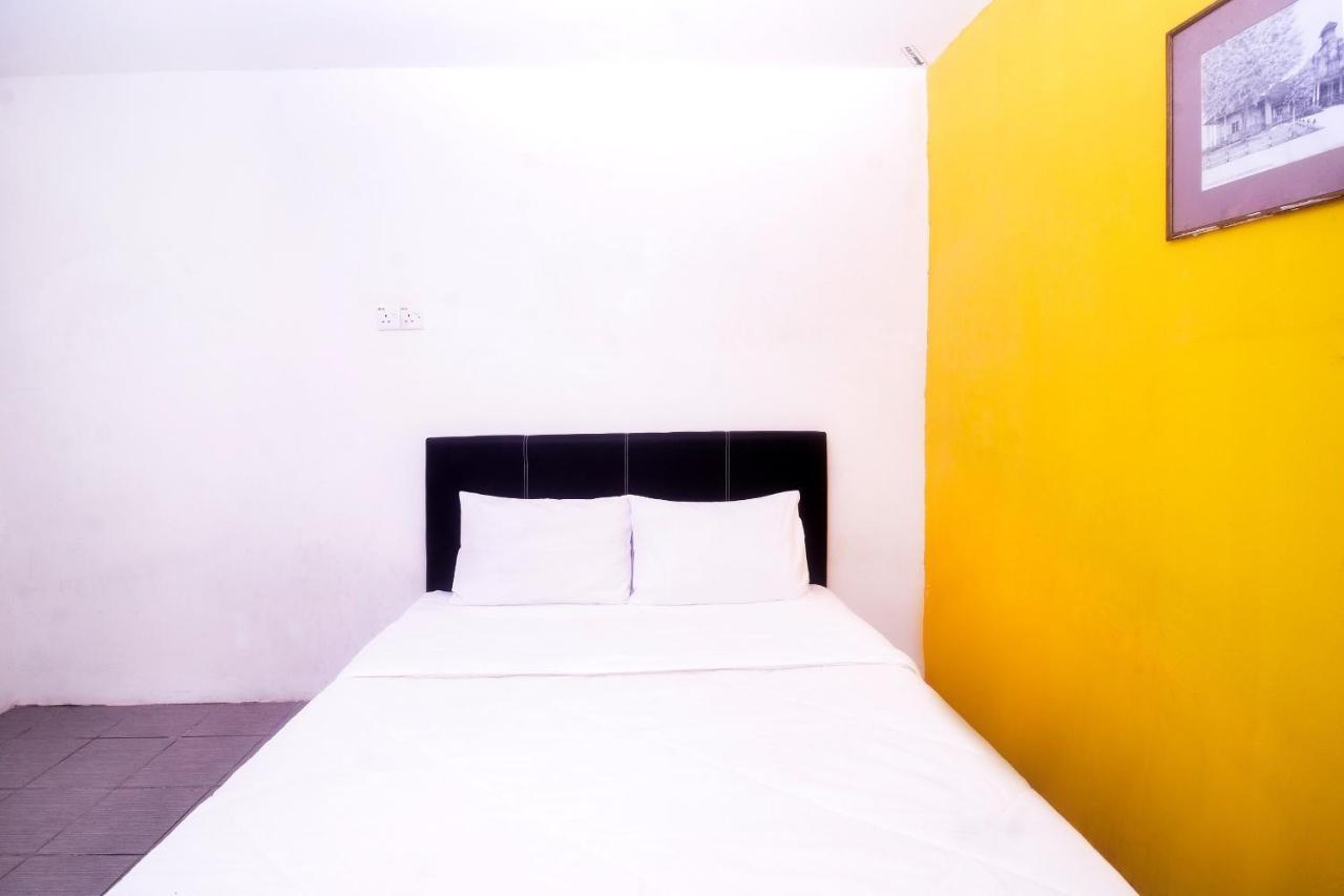 Spot On 89886 Backpacker'S Stay Services Kuching Extérieur photo