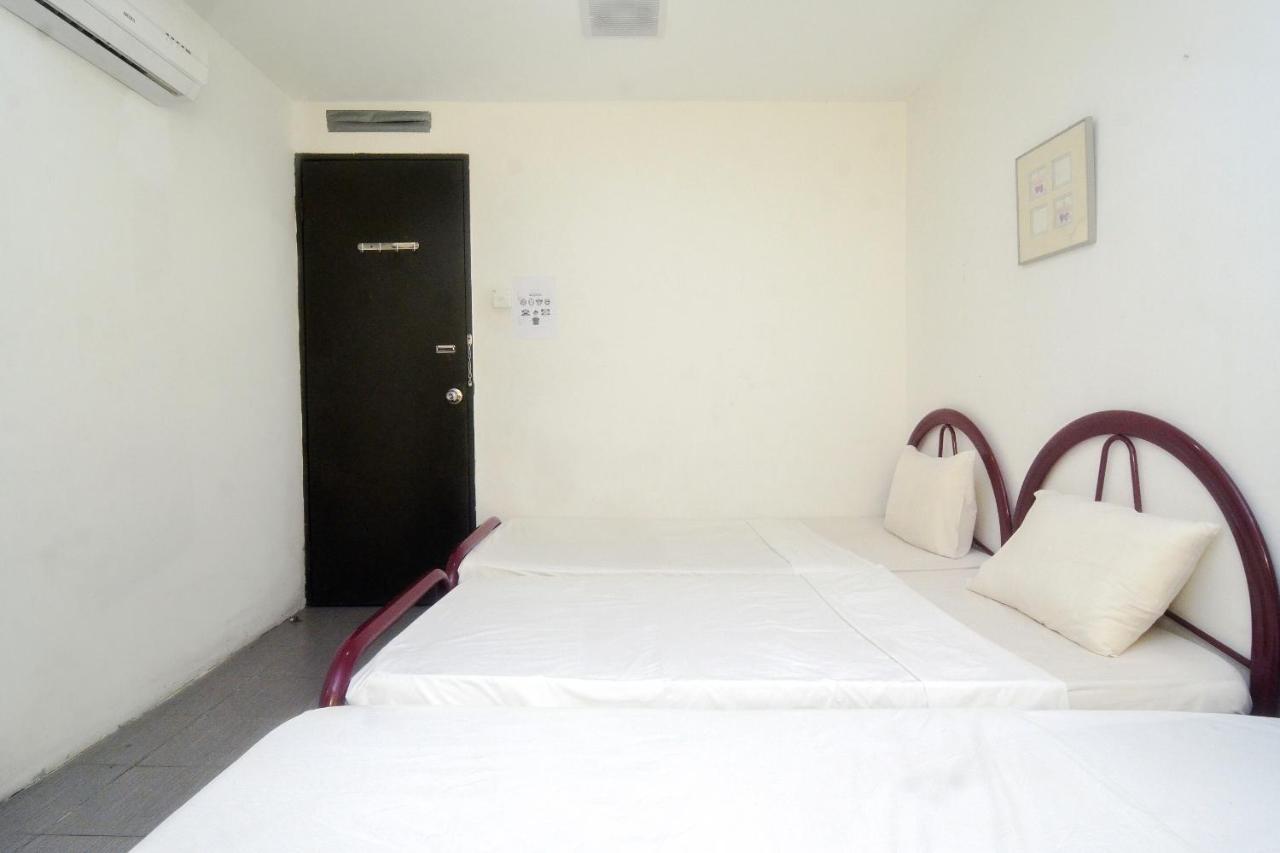 Spot On 89886 Backpacker'S Stay Services Kuching Extérieur photo