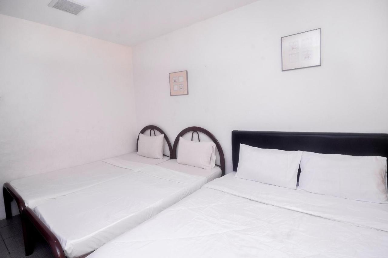 Spot On 89886 Backpacker'S Stay Services Kuching Extérieur photo