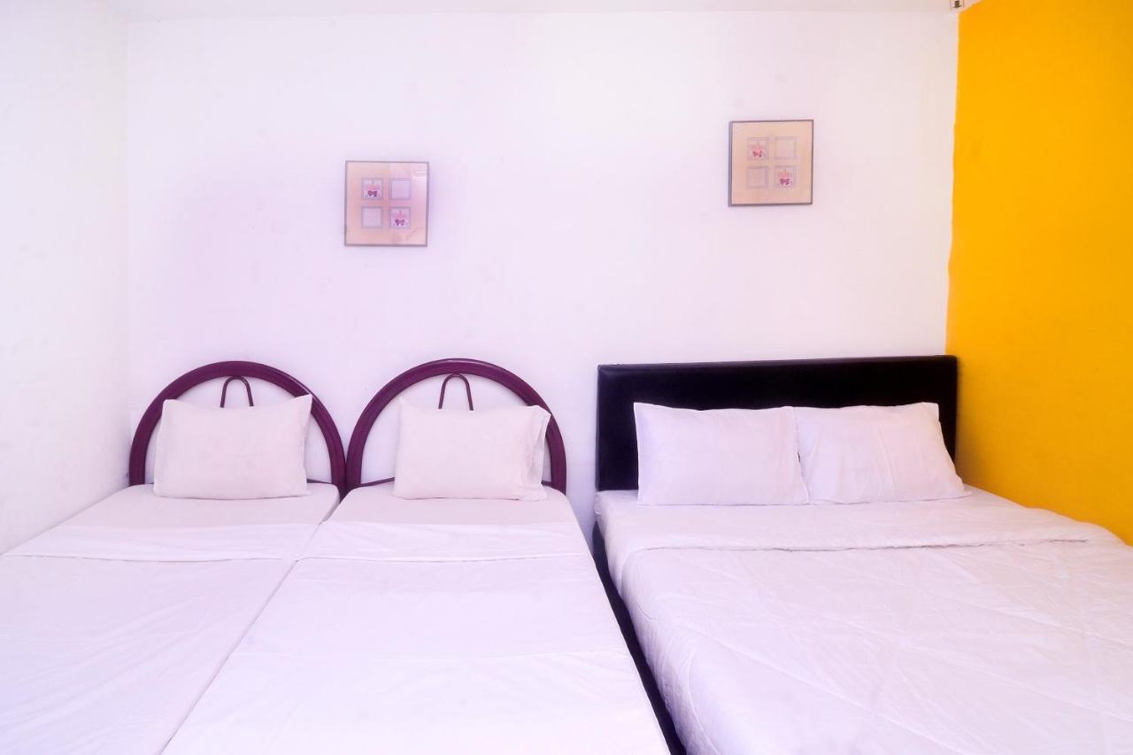 Spot On 89886 Backpacker'S Stay Services Kuching Extérieur photo